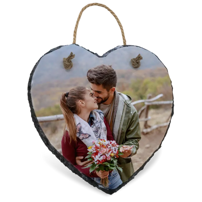 Heart-shaped slate photo plaque with a couple and flowers on a white background