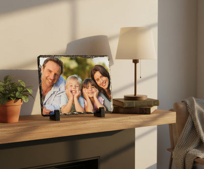 Family of four posing outdoors with a decorative black frame.
