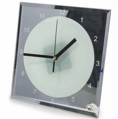 Square wall clock with a clear glass face on a white background